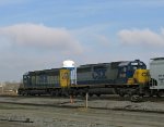 CSX 8128 & 8451 lead a train southbound